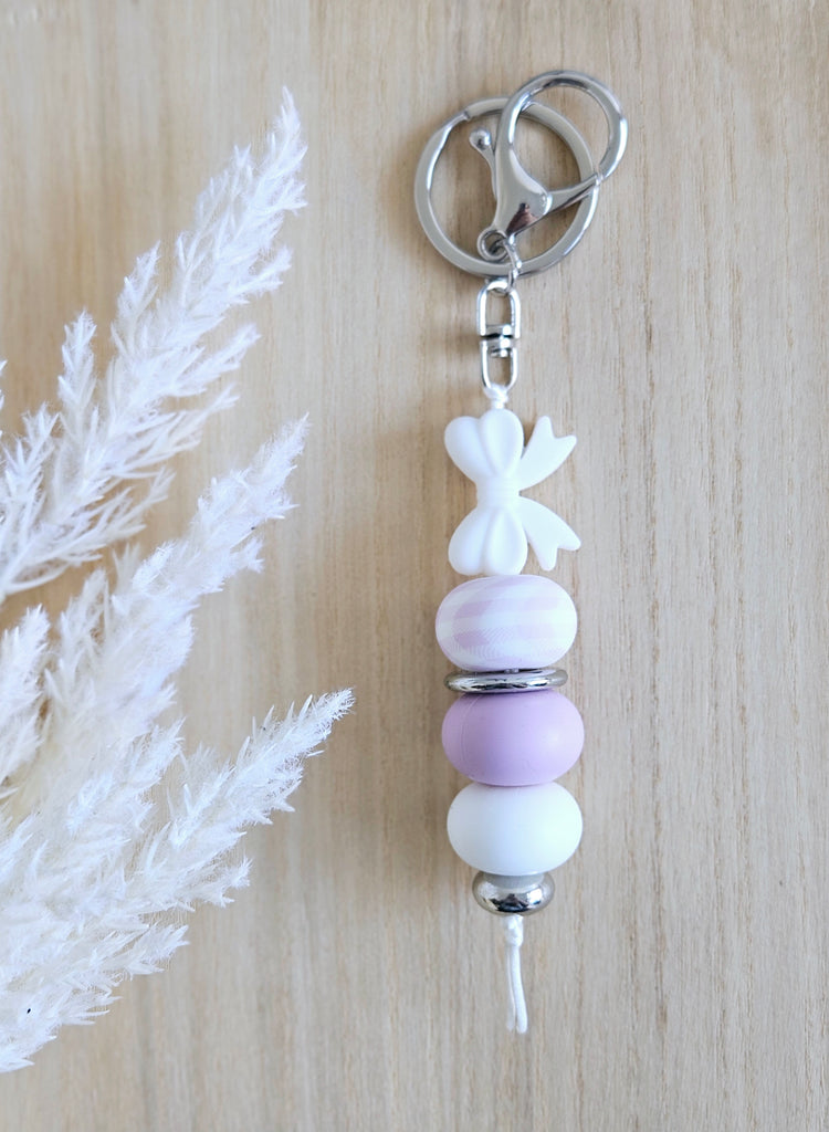 White and purple bow keyring